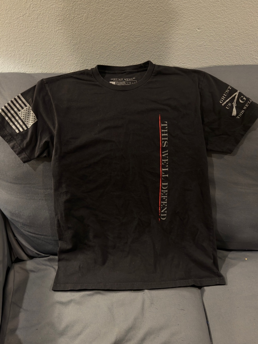 Grunt Style Black Short Sleeve 'This We'll Defend' Graphic Tee with Red Accent